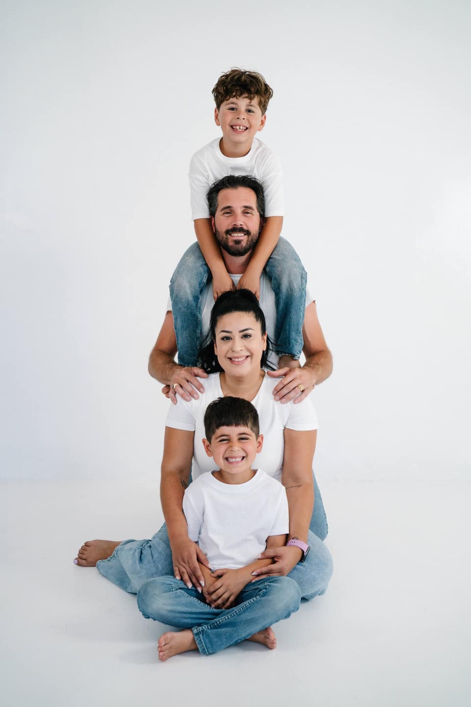 Little one smiling during an indoor family portrait session in Vacaville.